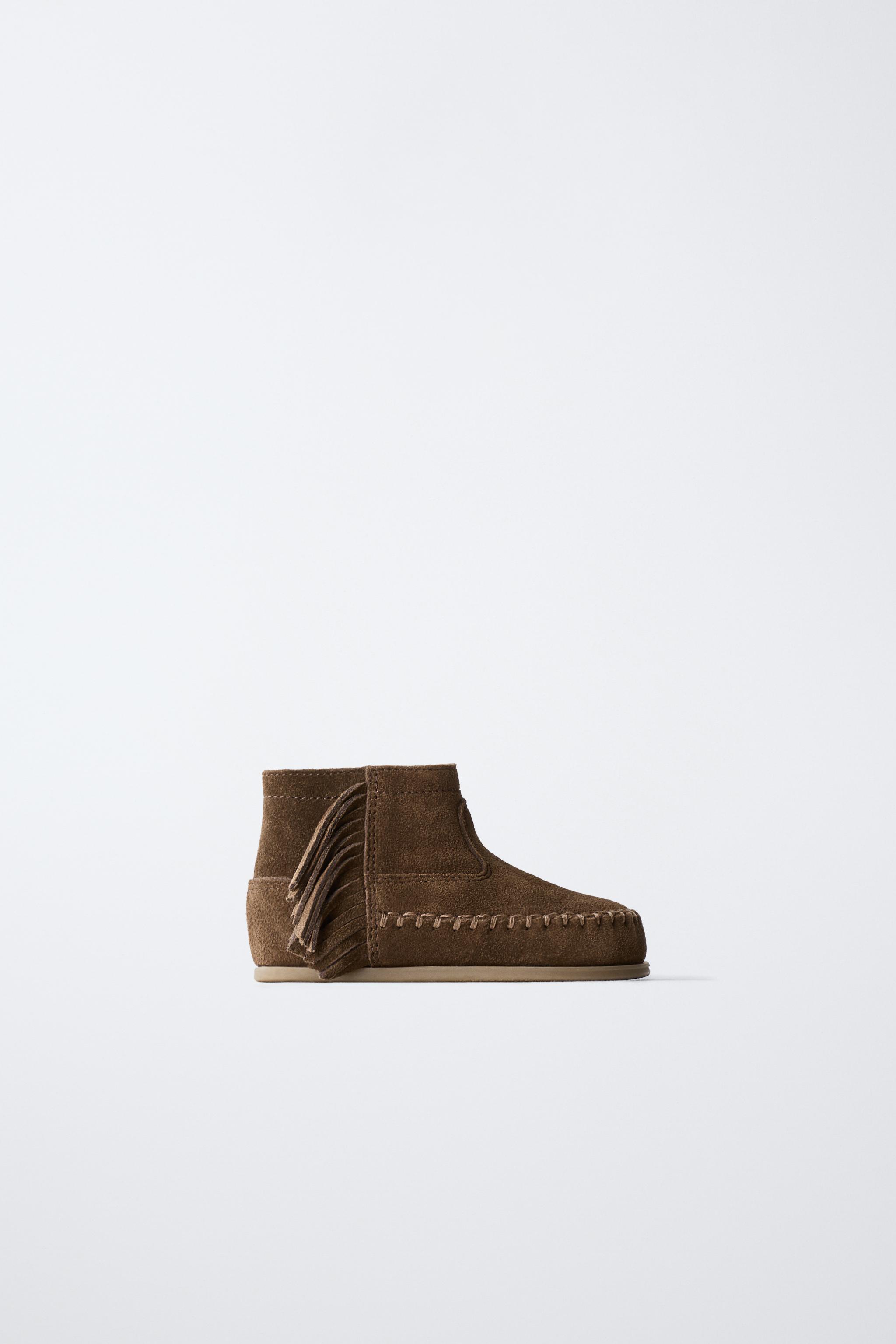 FRINGED LEATHER BOOTS
