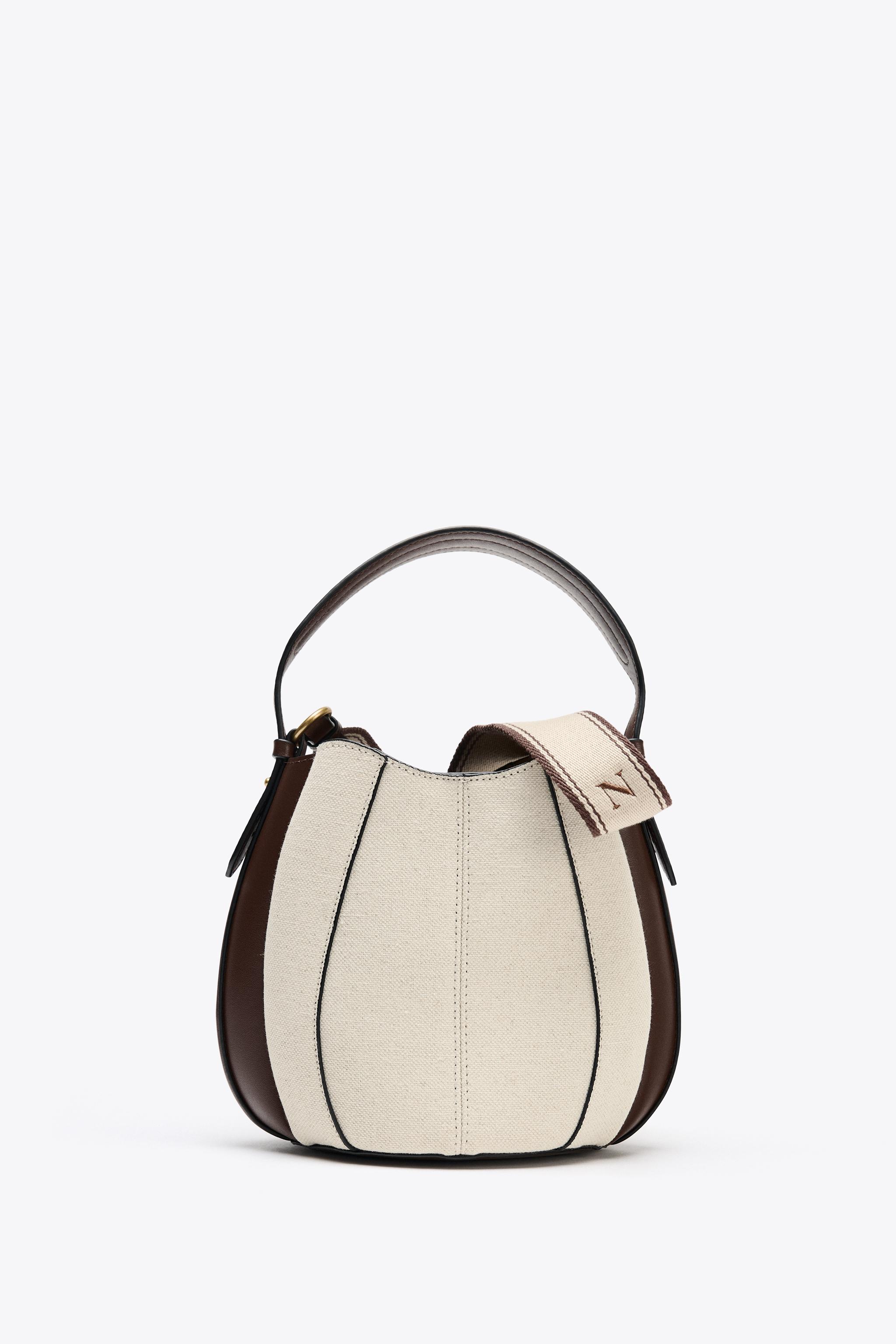 TOPSTITCHED BUCKET BAG