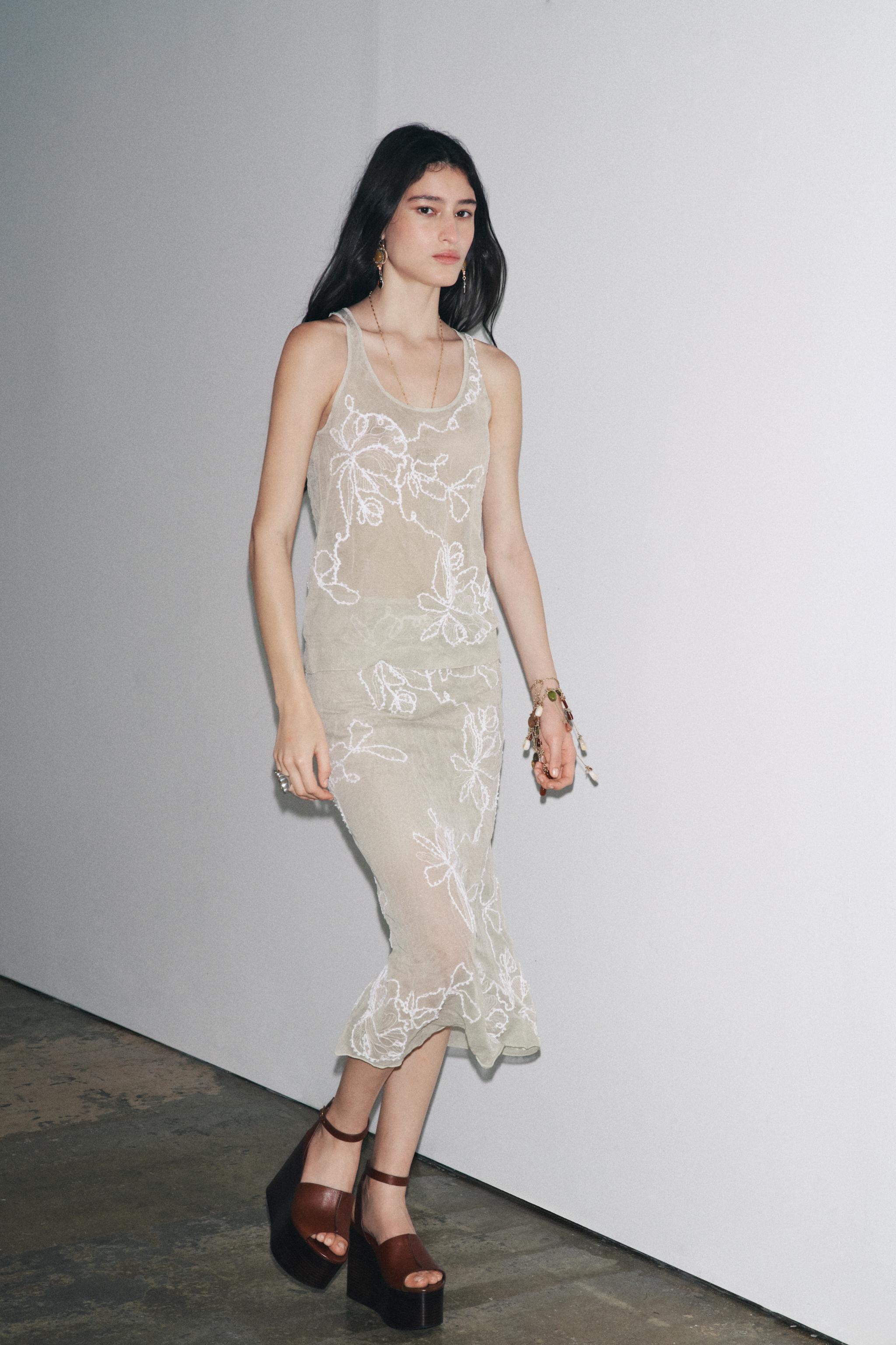 SEMI-SHEER STRUCTURED KNIT TOP